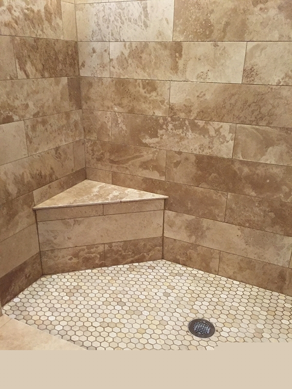 Traventine tile shower with porcelain mosaic tile floors Traventine tile shower with porcelain mosaic tile floors