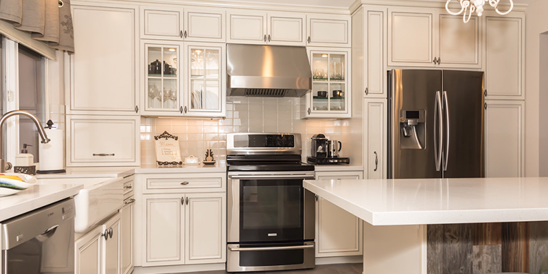 Cozy French Country Kitchen With Stainless Steel Appliances and A Distressed Wood Island Cozy French Country Kitchen With Stainless Steel Appliances and A Distressed Wood Island